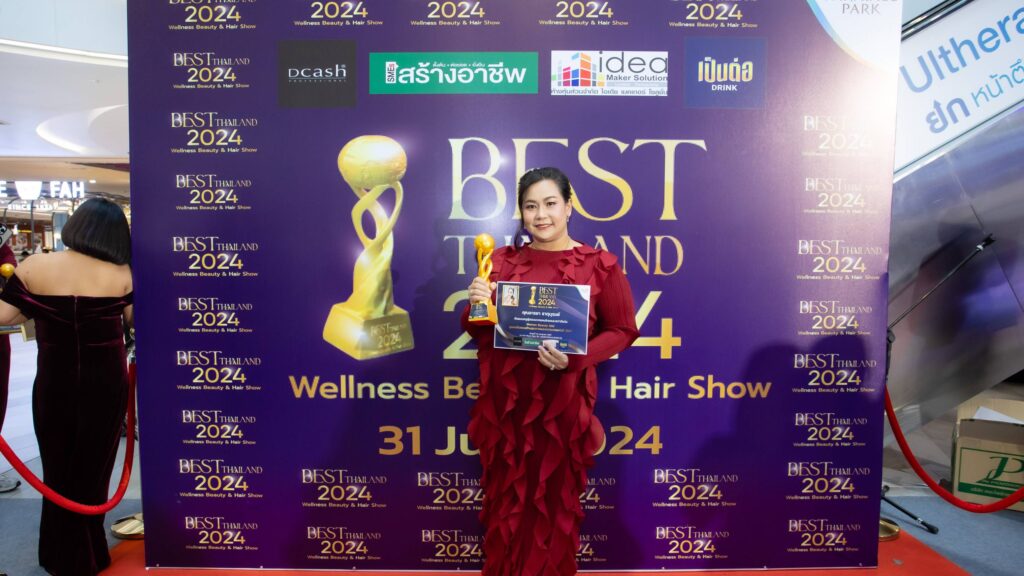 a woman holding a trophy