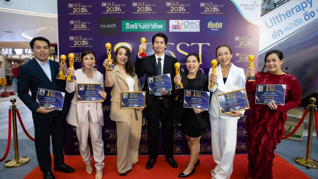 a group of people holding trophies
